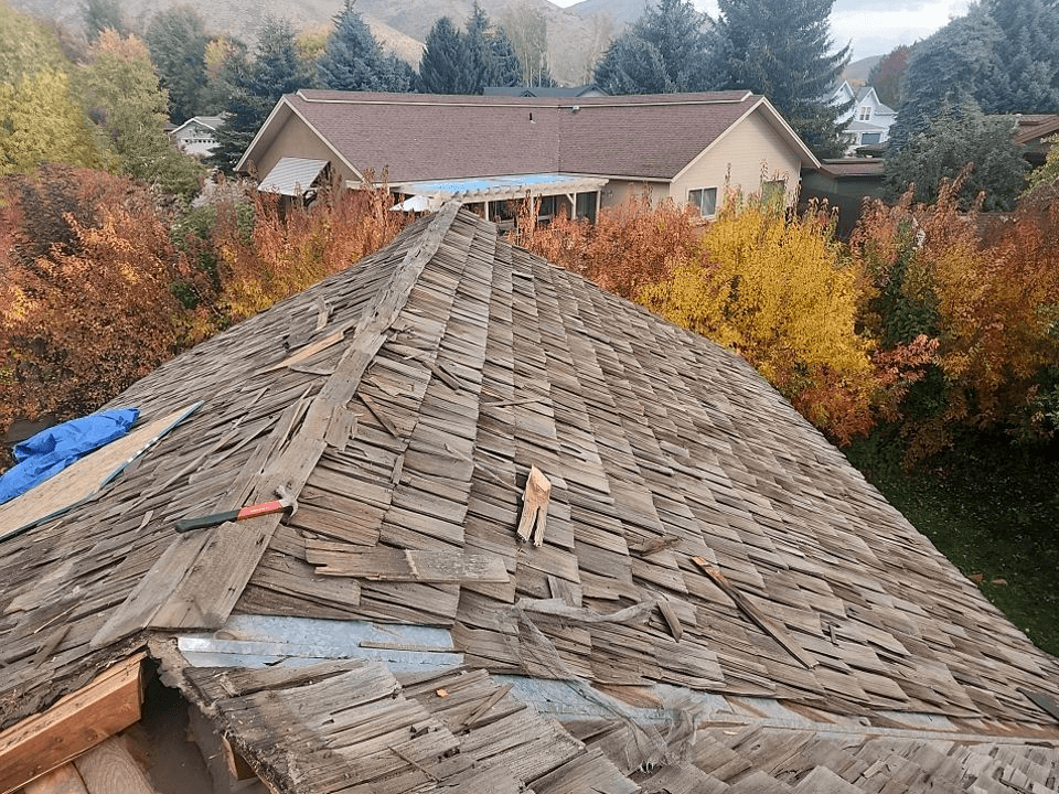 Idaho home with old wooden roof before cedar GAF roof replacement